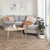 Karndean rose washed oak wood flooring laid in chevron in a living room