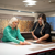 Woman browsing Karndean flooring options on a tablet.