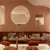 Terracotta dining area with a cosy, velvet bench