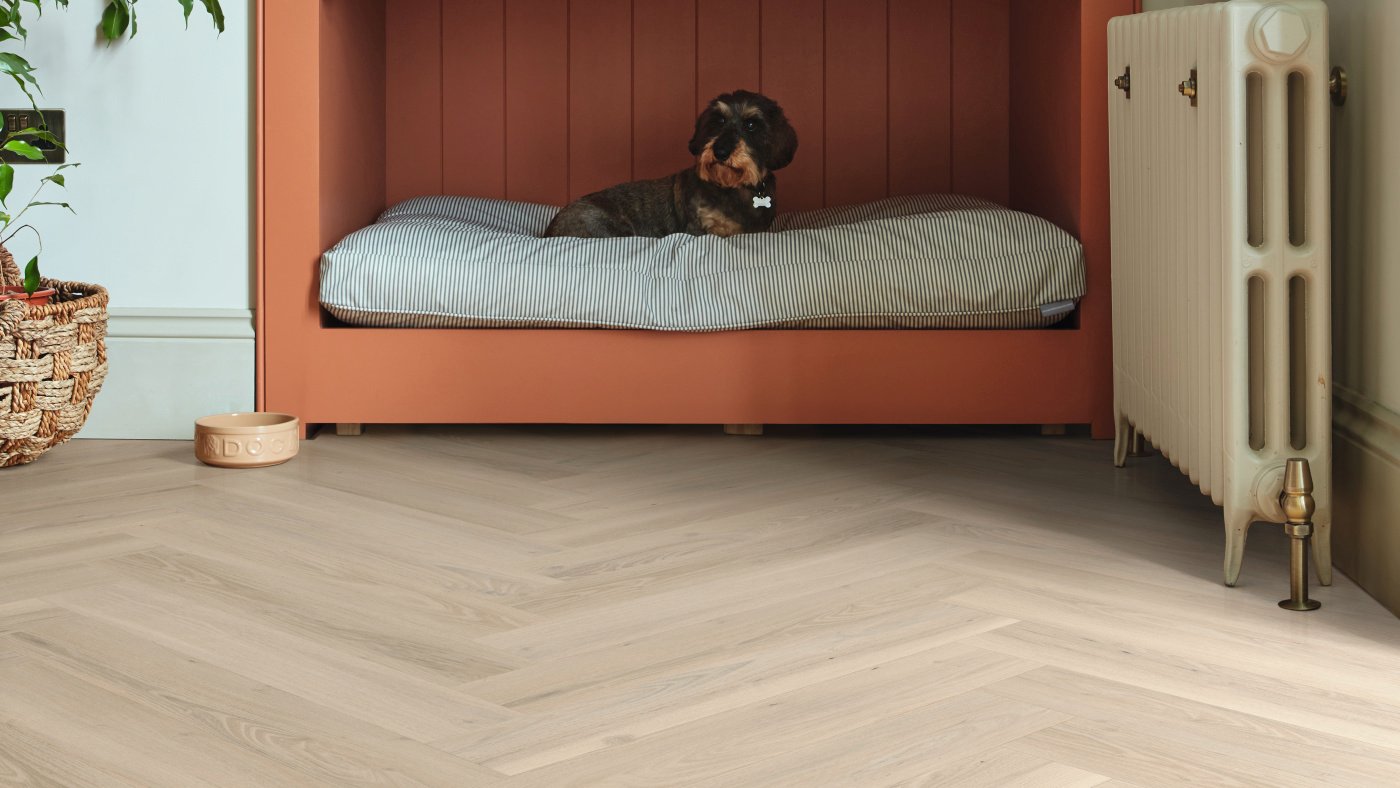 Norfolk Acacia wood lvp floors in a herringbone pattern add dimension to a hallway