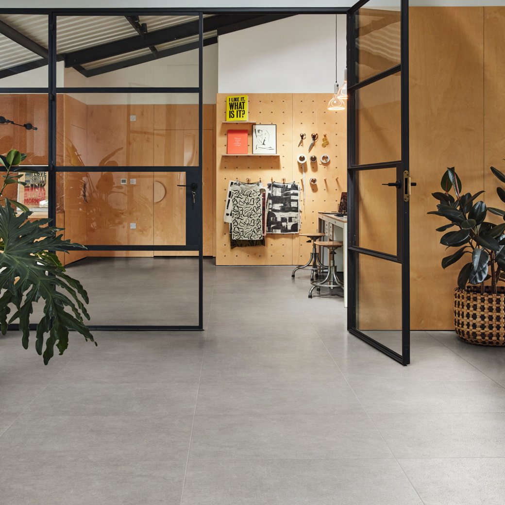 Art Select Cambric Stone dark grey LVT flooring in a private office 
