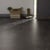 Van Gogh Canadian Urban Oak mid brown LVT flooring laid next to some shoes