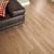 Van Gogh Birch dark brown lvt flooring laid in a living room