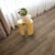 Cocoa limed oak dark brown lvt flooring laid in a living area next to a window