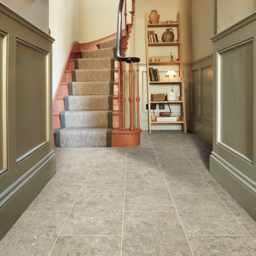 Lunar Limestone LVT flooring laid in a hallway with a design strip